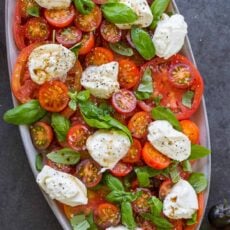 Burrata Salad with tomatoes on platter