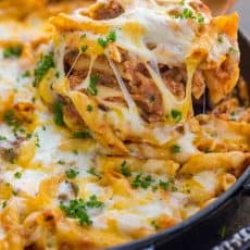 What is a lasagna casserole? This easy lasagna pasta bake has all the same elements of a classic lasagna, but the process is so easy! Everything is combined in a casserole dish (no layering) and this lasagna recipe bakes way faster! | natashaskitchen.com