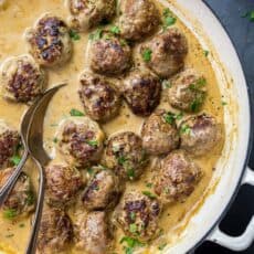 Swedish Meatballs in cream sauce with serving spoon