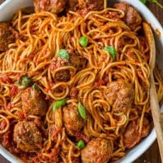 The Best Spaghetti & Meatballs!! Here's the secret to making meatballs uber juicy & tasty! #spaghettiandmeatballs #spaghettimeatballs #meatballs #spaghetti #pasta #italian #natashaskitchen